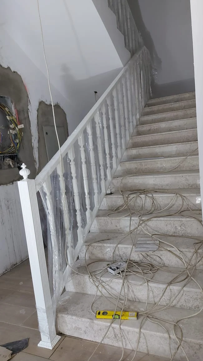 White staircase handrail