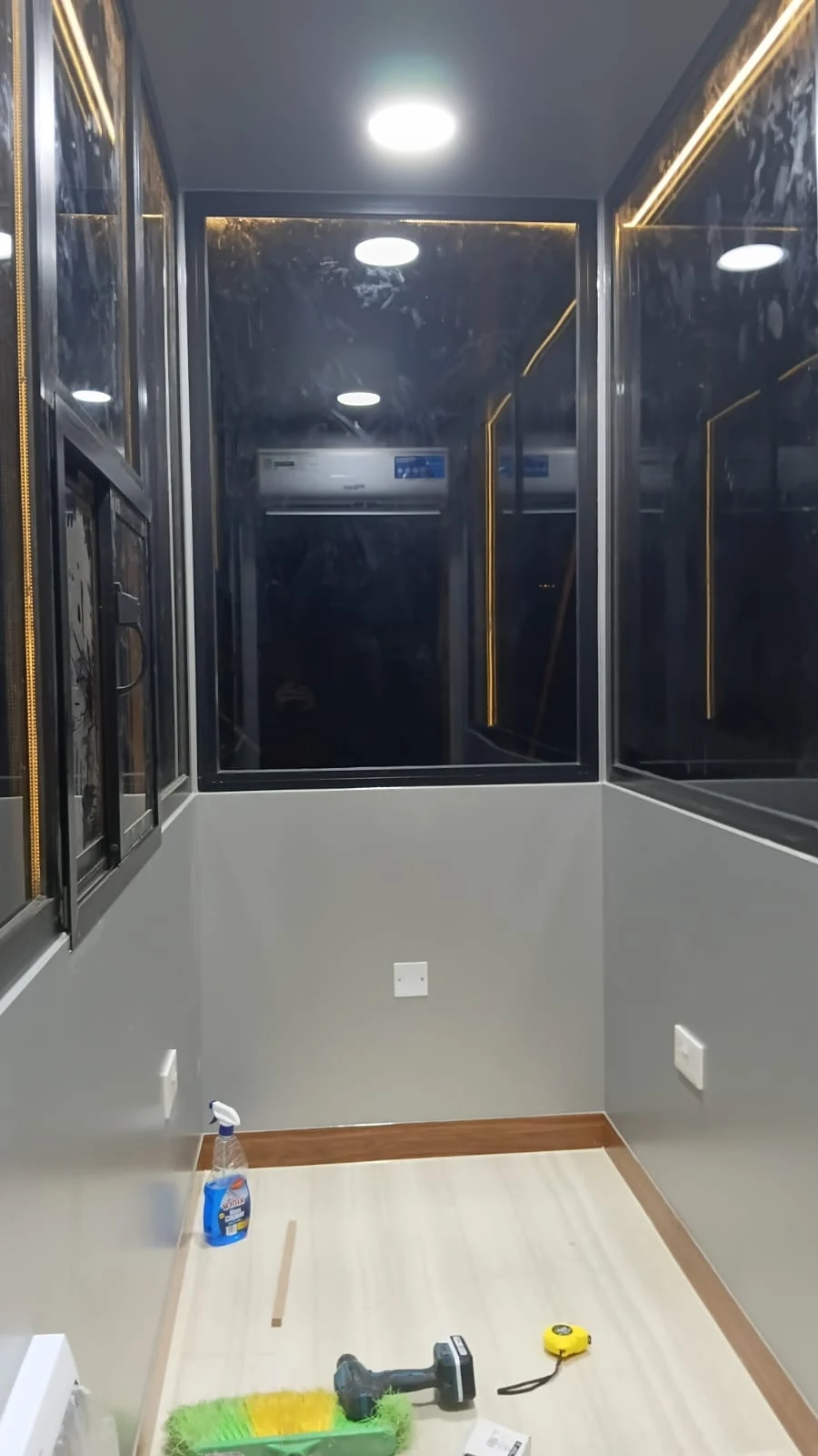 Illuminated glass and aluminium enclosure