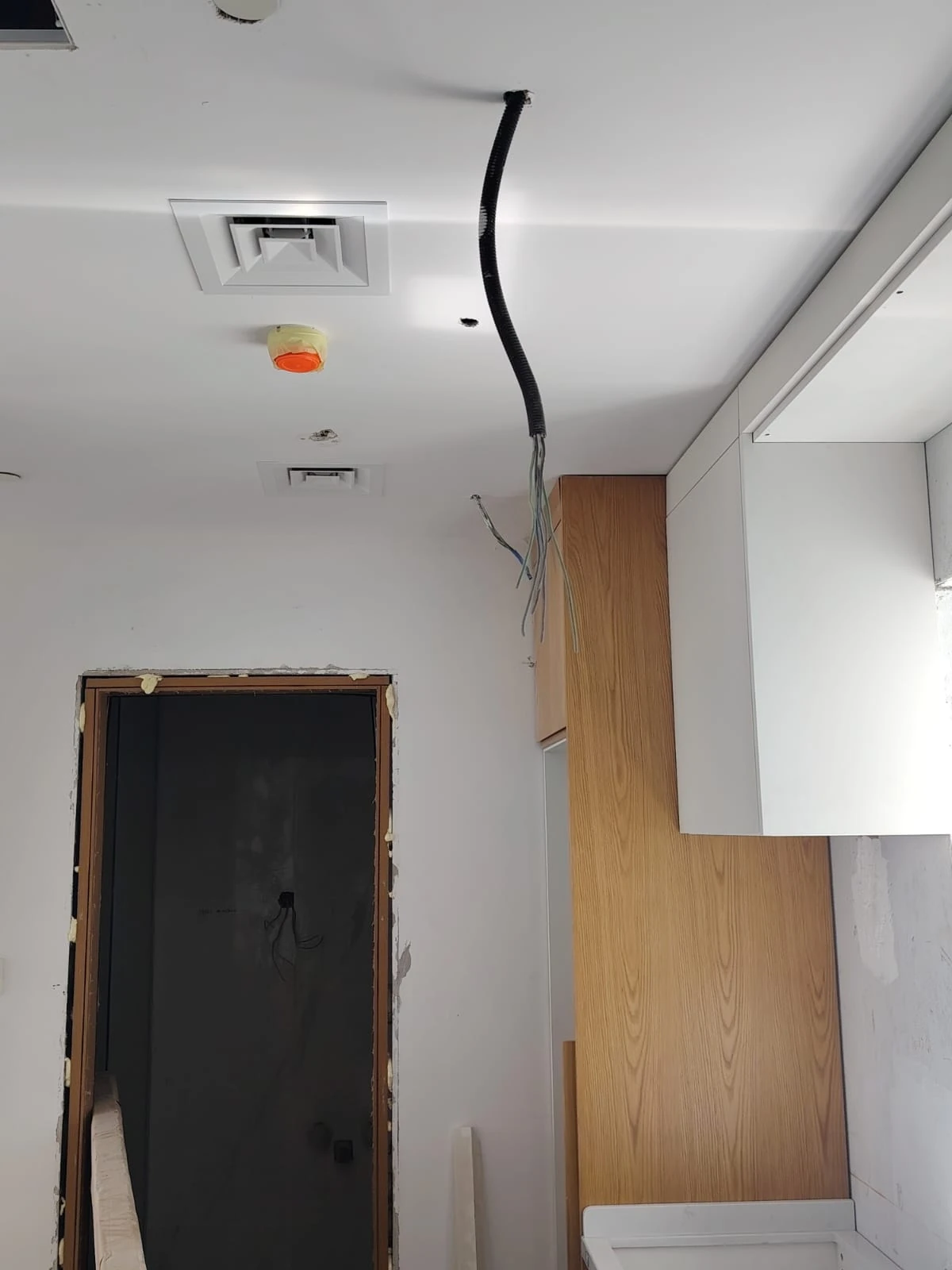 Interior area with ceiling and wall finishing work in progress