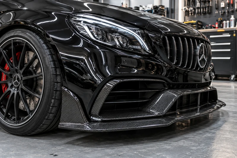 Carbon-fibre splitter and front bodywork detail on a Mercedes AMG