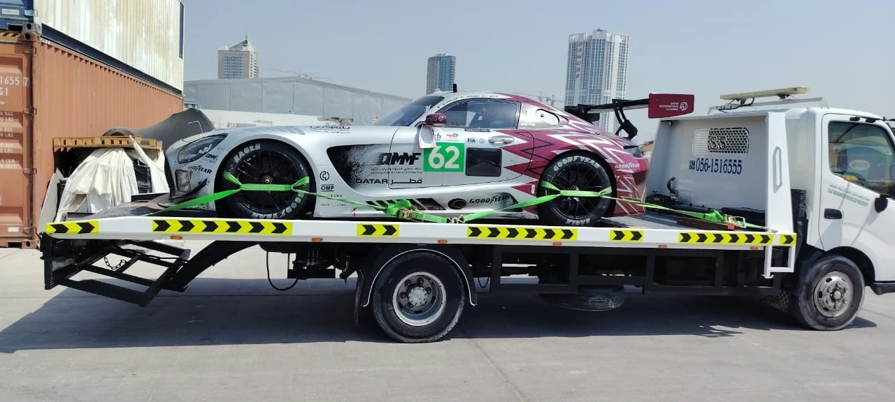 Race vehicle on a recovery flatbed