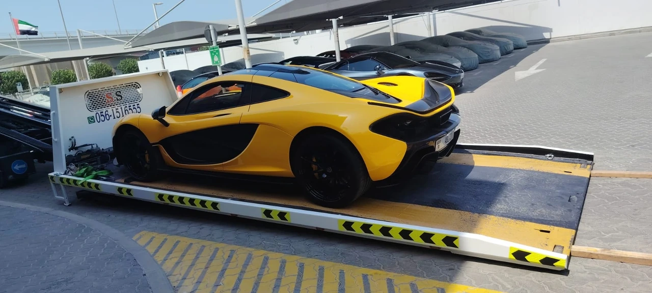 Yellow sports car on a flatbed