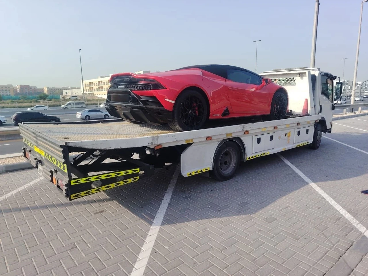 Vehicle secured on a recovery flatbed
