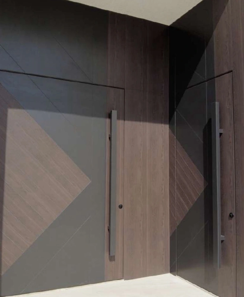 A coordinated wood-tone entrance with opposing chevron patterns across the door and surrounding panels.