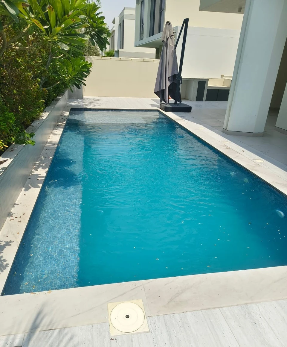 Client photo of a pool beside a villa